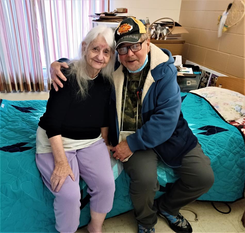 Alice & Lyle posing with Alice's new Buffalo Star quilt @ St Charles Nursing Home!  